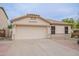 Charming single-story home with a neutral color palette and a two-car garage at 2439 W White Feather Ln, Phoenix, AZ 85085