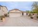 Beautiful single-story home featuring a spacious driveway and well-maintained landscaping at 2439 W White Feather Ln, Phoenix, AZ 85085