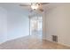 Spacious living area featuring a ceiling fan and arched entryway to other living areas at 2439 W White Feather Ln, Phoenix, AZ 85085