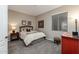 Cozy bedroom features a wood-framed bed and neutral color palette, creating a relaxing atmosphere at 250 W Queen Creek Rd # 146, Chandler, AZ 85248