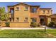 Exterior view of a charming two-story townhome featuring an open balcony at 250 W Queen Creek Rd # 146, Chandler, AZ 85248