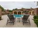 Community pool featuring poolside lounge chairs and a table for relaxing at 250 W Queen Creek Rd # 146, Chandler, AZ 85248