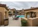 Community pool and patio seating area with desert landscaping at 250 W Queen Creek Rd # 146, Chandler, AZ 85248