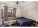 Cozy bedroom featuring a comfortable daybed, neutral colors, and window at 2512 N Central Dr, Chandler, AZ 85224