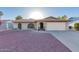 Charming single-story home with brick facade, well-maintained landscaping, and an attached two-car garage at 2512 N Central Dr, Chandler, AZ 85224