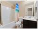 Bathroom featuring a shower/tub combo and vanity with storage at 2748 W Sunland Ave, Phoenix, AZ 85041