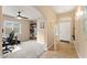 Open foyer featuring tiled flooring, neutral paint, a ceiling fan and adjacent living spaces at 2748 W Sunland Ave, Phoenix, AZ 85041