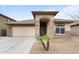 Charming single-story home featuring a stone facade, arched entry, and a well-maintained desert landscape at 2748 W Sunland Ave, Phoenix, AZ 85041