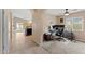 Bright living room with tiled floors transitioning to carpet, arched doorways and natural light at 2748 W Sunland Ave, Phoenix, AZ 85041