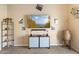 Well-lit living room with modern décor and a view of the surrounding neighborhood at 2748 W Sunland Ave, Phoenix, AZ 85041