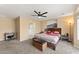 Spacious main bedroom featuring a ceiling fan, ensuite bathroom, and modern decor at 2748 W Sunland Ave, Phoenix, AZ 85041