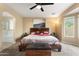 Spacious main bedroom featuring a ceiling fan, ensuite bathroom, and modern decor at 2748 W Sunland Ave, Phoenix, AZ 85041