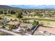 An aerial view captures a desert home near a golf course with a private backyard pool at 302 W Thunderbird Rd, Phoenix, AZ 85023