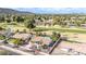 An aerial view captures a desert home near a golf course with a private backyard pool at 302 W Thunderbird Rd, Phoenix, AZ 85023