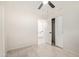 Bedroom featuring tile floor, ceiling fan, neutral paint, and sliding closet doors at 302 W Thunderbird Rd, Phoenix, AZ 85023