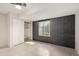 Bedroom featuring tile floor, painted brick, and closet with built-in shelving at 302 W Thunderbird Rd, Phoenix, AZ 85023