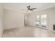 Bright bedroom featuring tiled floors, ceiling fan, and French doors leading to the pool at 302 W Thunderbird Rd, Phoenix, AZ 85023