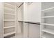 Walk-in closet with ample shelving and storage space with tile floors, ideal for organization at 302 W Thunderbird Rd, Phoenix, AZ 85023