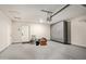 Garage featuring painted walls, a door to the outside, and built-in gray storage cabinets at 302 W Thunderbird Rd, Phoenix, AZ 85023