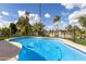 Fenced swimming pool with tanning deck and lush landscaping creates a private backyard oasis at 302 W Thunderbird Rd, Phoenix, AZ 85023