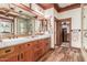 Luxurious bathroom with dual sinks, custom cabinets, and walk-in closet at 3123 E Cat Balue Dr, Phoenix, AZ 85050