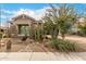 Single-story house with beautiful curb appeal, desert landscaping, and a brick-paved driveway at 3123 E Cat Balue Dr, Phoenix, AZ 85050