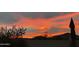 Picturesque outdoor sunset image from the back yard, showing distant mountains and glowing skies at 3123 E Cat Balue Dr, Phoenix, AZ 85050