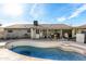 Backyard pool view with a blue water pool, and an exterior house view at 323 N Hunt E Dr, Mesa, AZ 85203