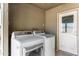 Functional laundry room with washer and dryer, plus convenient access to the outdoors at 323 N Hunt E Dr, Mesa, AZ 85203