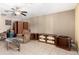 Living room with tile floors, ceiling fan and open shelving at 323 N Hunt E Dr, Mesa, AZ 85203