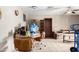 Living room featuring tile floors, a dining table, and a ceiling fan at 323 N Hunt E Dr, Mesa, AZ 85203