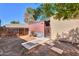 Fenced backyard featuring landscaping with stone pathway to building at 3324 W Tangerine Ln, Phoenix, AZ 85051