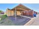 Spacious carport featuring a covered parking area next to a home at 3324 W Tangerine Ln, Phoenix, AZ 85051