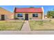 Charming single-story home with a red tile roof and well-maintained front yard at 3324 W Tangerine Ln, Phoenix, AZ 85051