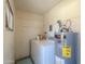 Interior view of laundry room with washer, dryer, and water heater at 3324 W Tangerine Ln, Phoenix, AZ 85051