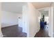 A view through arched doorways to the living room, office and entrance area at 3324 W Tangerine Ln, Phoenix, AZ 85051