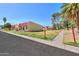 Street view of homes with well-maintained lawns and desert landscaping on a sunny day at 3324 W Tangerine Ln, Phoenix, AZ 85051