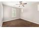 Neutral bedroom with a ceiling fan and plantation shutters allowing natural light at 3632 E Comstock Dr, Gilbert, AZ 85296