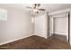 Neutral bedroom with closet and ceiling fan providing both storage and comfort at 3632 E Comstock Dr, Gilbert, AZ 85296