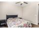 Well-lit bedroom with a modern ceiling fan, bedside tables, and a comfortable queen bed at 3632 E Comstock Dr, Gilbert, AZ 85296