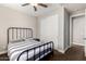 Cozy bedroom featuring a sliding door closet, a ceiling fan, and a queen-size bed at 3632 E Comstock Dr, Gilbert, AZ 85296