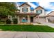 Charming two-story home with a welcoming front porch and manicured lawn at 3632 E Comstock Dr, Gilbert, AZ 85296