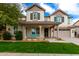 Beautiful two-story home with a covered porch and a well-maintained lawn at 3632 E Comstock Dr, Gilbert, AZ 85296