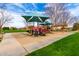 Neighborhood playground with slides, climbing structures, and covered picnic areas for Gathering enjoyment at 3632 E Comstock Dr, Gilbert, AZ 85296