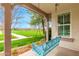 Close-up of a charming blue porch swing, perfect for relaxing outdoors at 3632 E Comstock Dr, Gilbert, AZ 85296