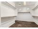 Open walk-in closet providing ample storage space with shelving on all sides at 3632 E Comstock Dr, Gilbert, AZ 85296