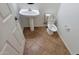 Clean half-bath with tile flooring and pedestal sink at 3829 W Ashton Dr, Anthem, AZ 85086