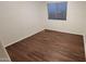 Empty bedroom with wood flooring and a large window at 3829 W Ashton Dr, Anthem, AZ 85086