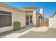 Home exterior showcasing a neutral color scheme, security door, well maintained landscaping, and a private courtyard at 3904 E Carter Dr, Phoenix, AZ 85042