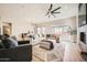 Bright living room boasting an expansive sectional sofa, stylish rug, and view to the dining area at 3904 E Carter Dr, Phoenix, AZ 85042